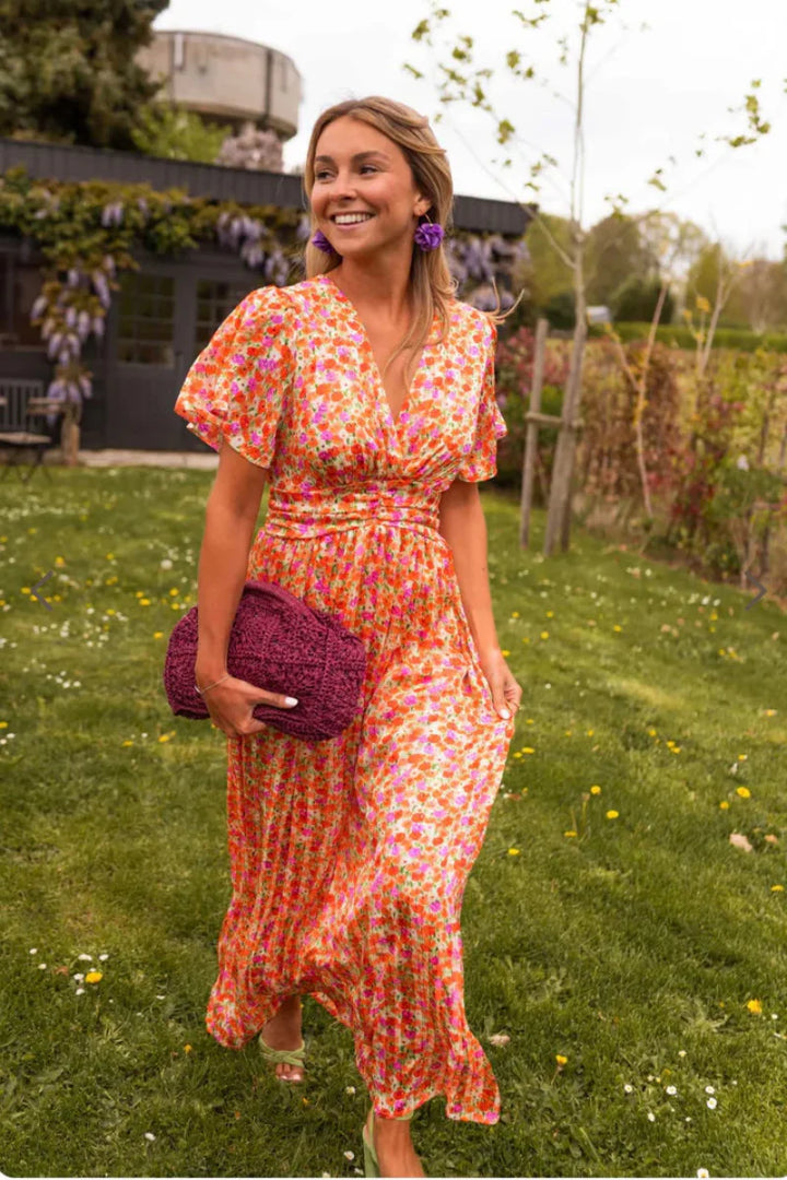 KYNAVA – MAXIKLEID MIT HERZAUSSCHNITT UND BLUMENPRINT