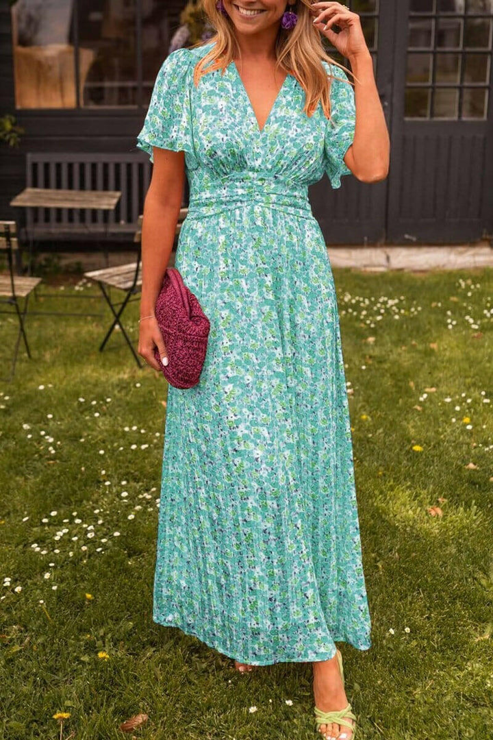 KYNAVA – MAXIKLEID MIT HERZAUSSCHNITT UND BLUMENPRINT