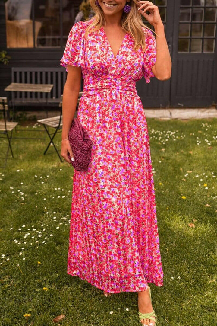 KYNAVA – MAXIKLEID MIT HERZAUSSCHNITT UND BLUMENPRINT